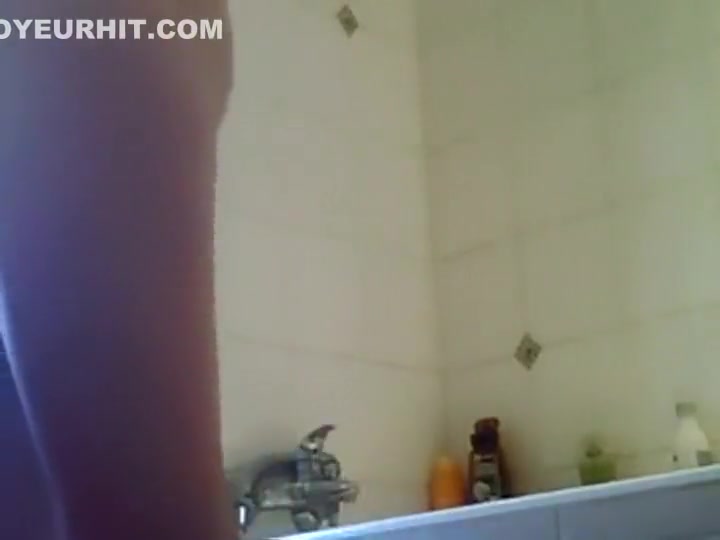 Tattooed girl voyeured in the shower