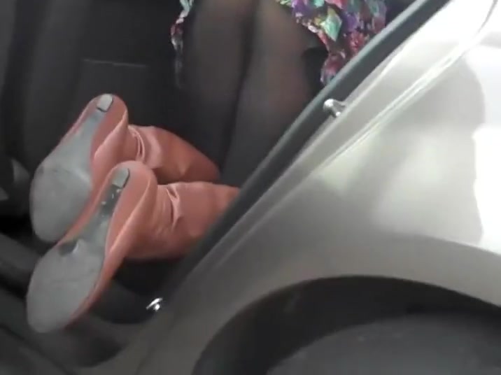 Butt covered with pantyhose in a car