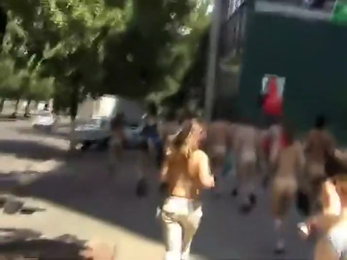 Naked students do a running protest