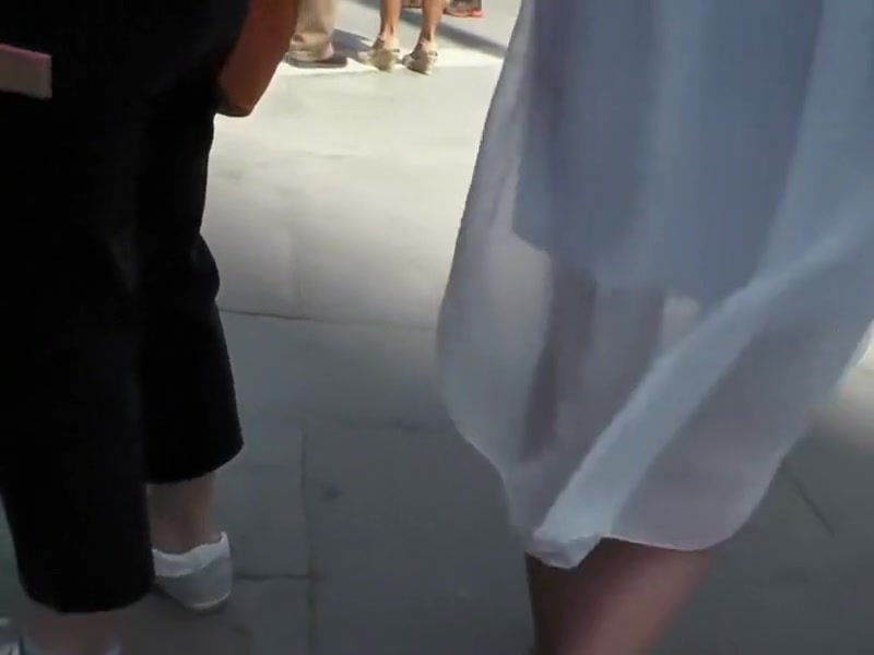 Cute girl in a white summer dress