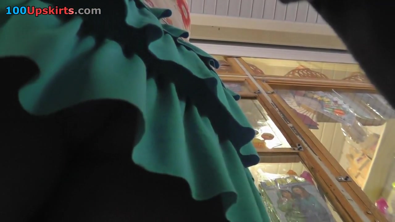 Peek up her tiered green petticoat
