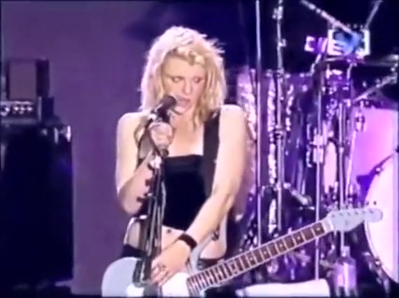 Hot rockstar plays a song with her boobs out in the open