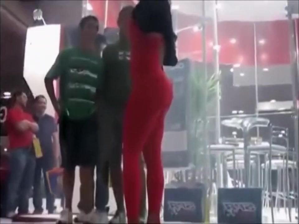 Hot model in tight red suit mingles with the crowd at the club