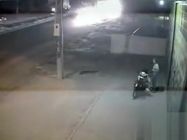 Female motorcyclist gets caught on security cam urinating