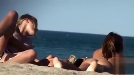 Lesbian girls sunbathe with their natural tits out