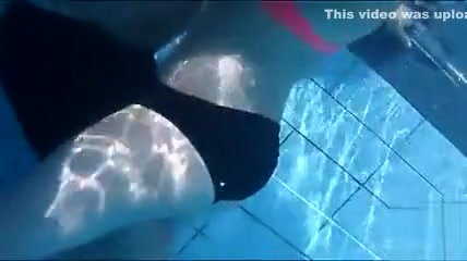 Playgirl tugs on a friend's dick in the pool