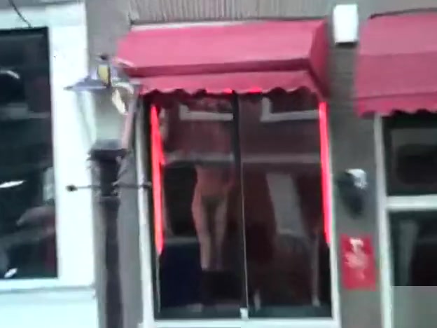 Amsterdam prostitutes tease in the windows