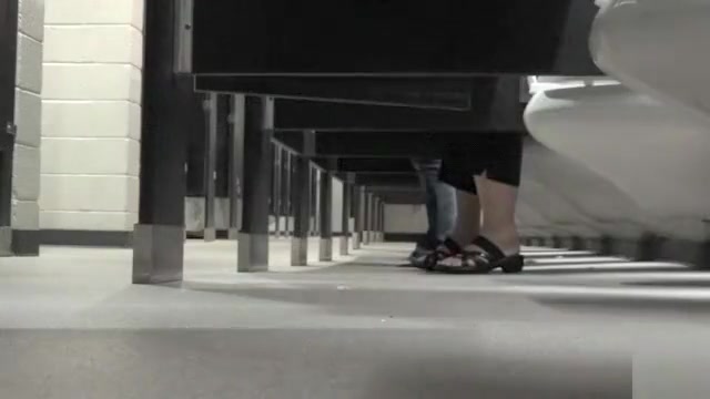 Foot fetish cam in busy public restroom