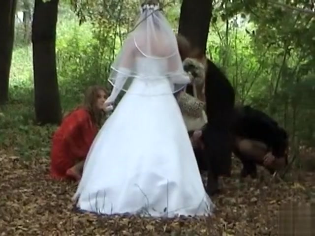 Russian bride and her bridesmaids pee in the woods
