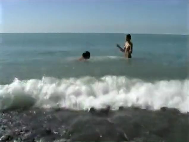 Naked brunette teens splash in the lake