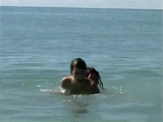 Naked brunette teens splash in the lake