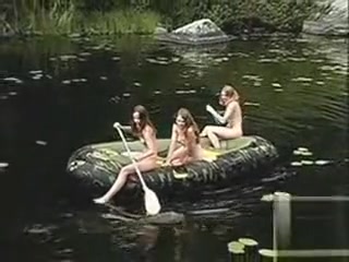 Naked teens go boating on the lake