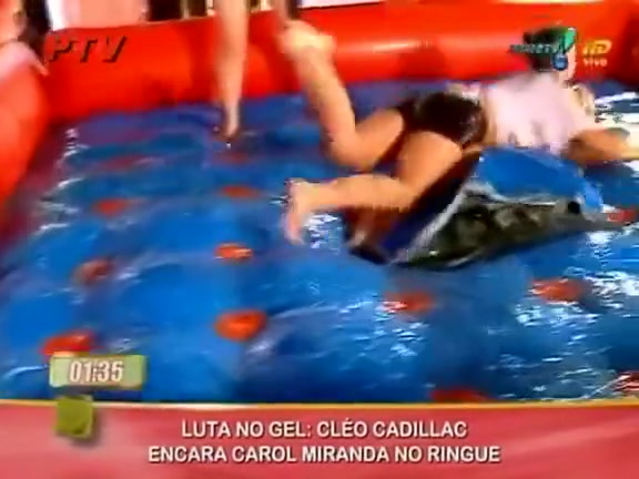 Sexy oil wrestling live on Latin television