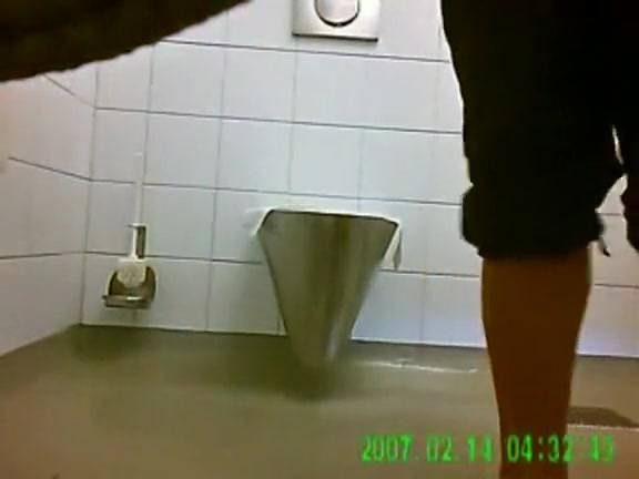 Squatting ladies pee in a public toilet