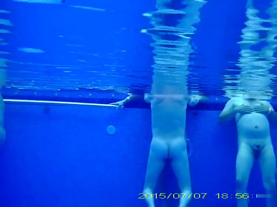 Underwater sex in the pool at the nudist resort