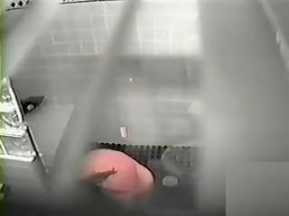 Hidden cam shows a curvy woman showering