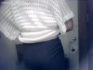 Lovely sweater on a cute woman going to the toilet