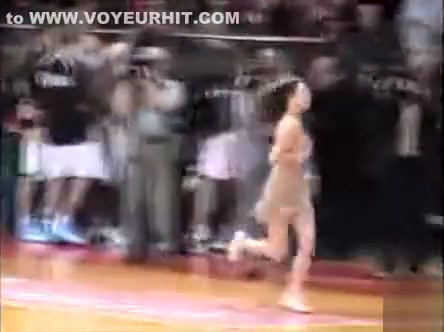 Topless girl streaks at a basketball game