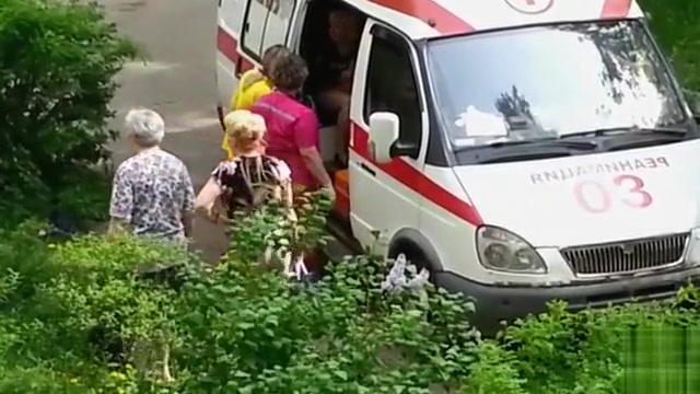 Ambulance picks up lady passed out in the grass