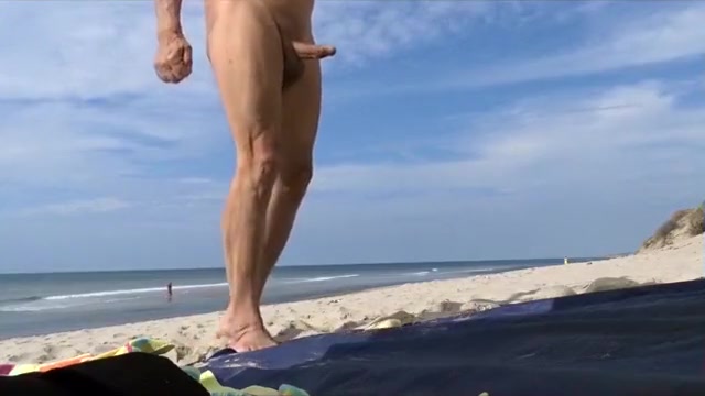 Older man jerks his dick on the beach