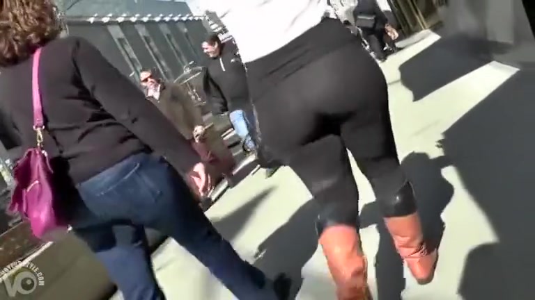 Big butt woman walks the city streets in spandex
