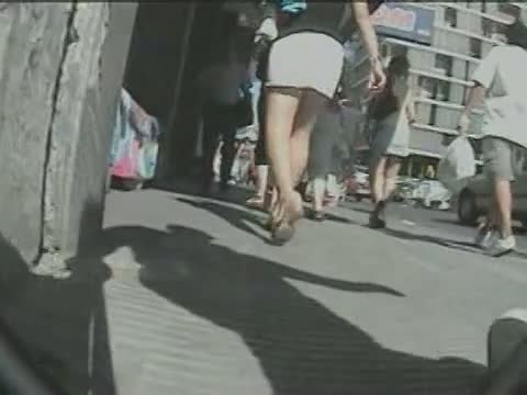 Voyeur on the street is hunting for sexy up skirts