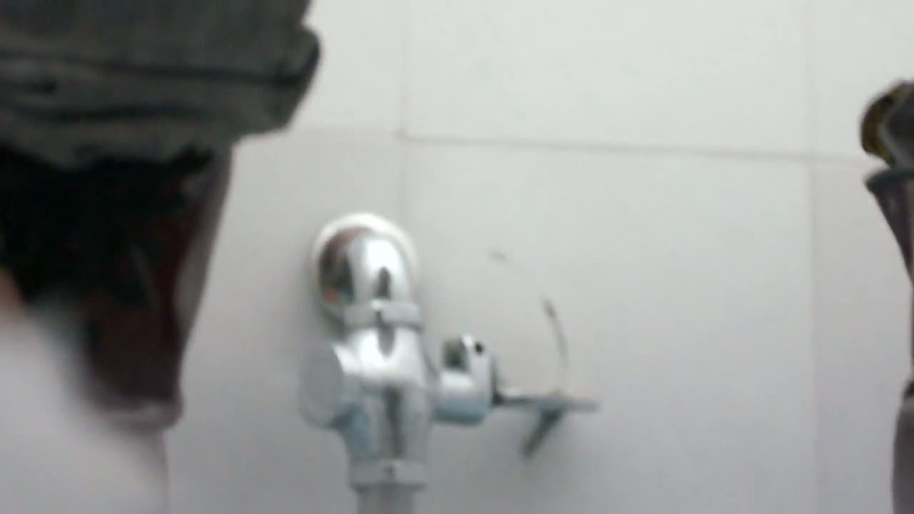 Toilet spy cam show a look at a girl's muff peeing