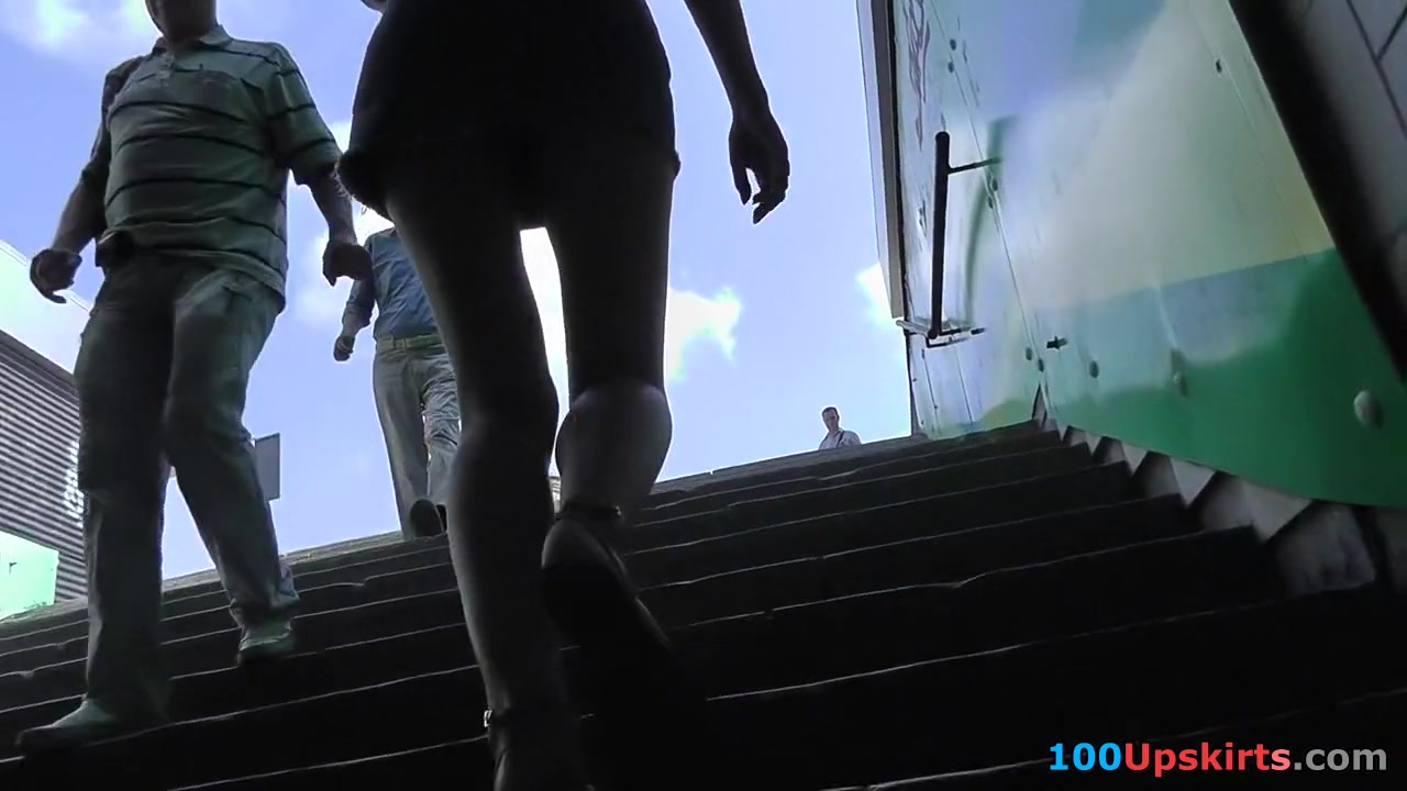 Gal on stairs provides with sexy upskirt