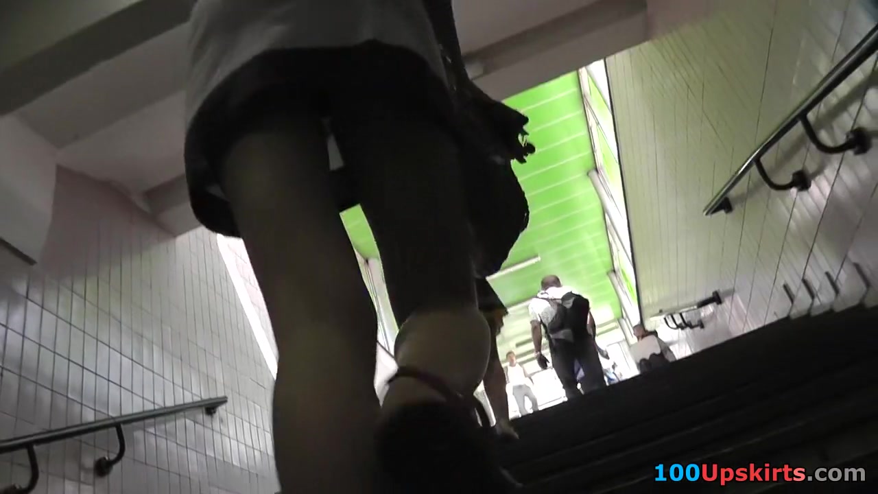 Skinny blond upskirt on the stairs