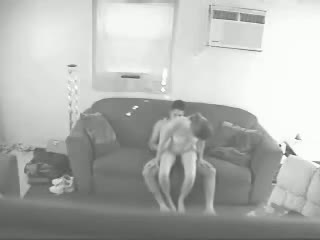 A married couple has sex on the couch