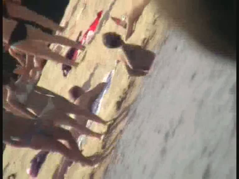 Nude beach voyeur film making extravaganza with hoes on the phone