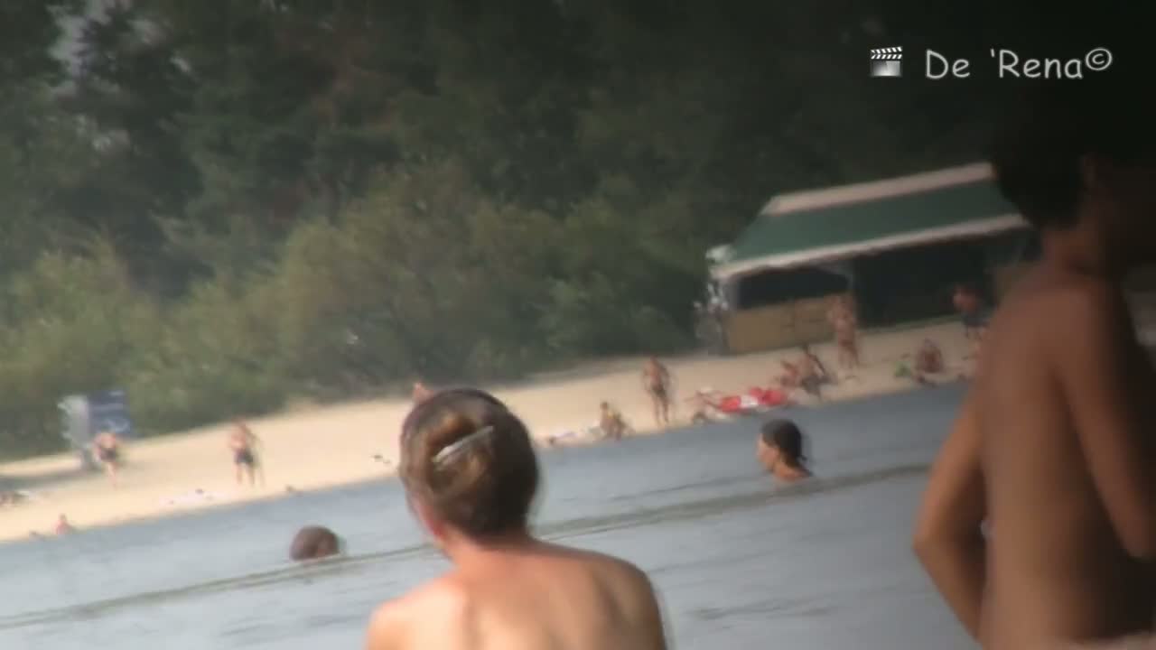 Black hair topless woman in the nude beach candid video