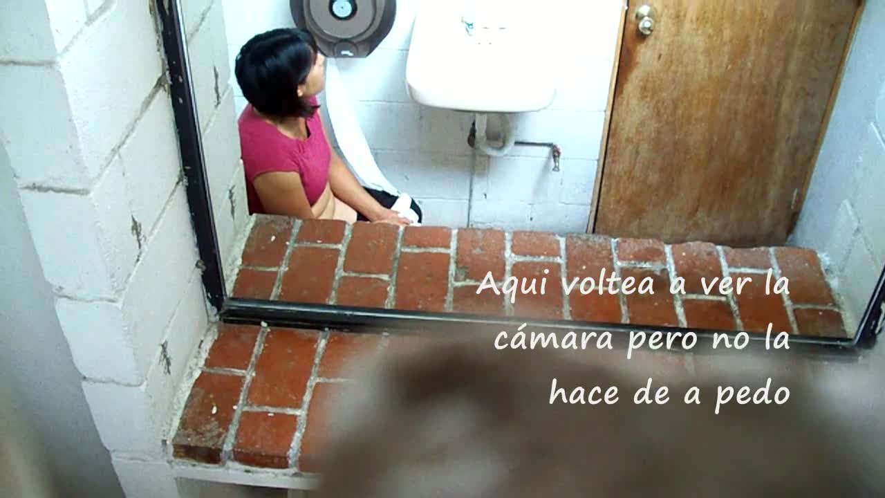 Black haired chubby girl taking a piss and blowing her nose