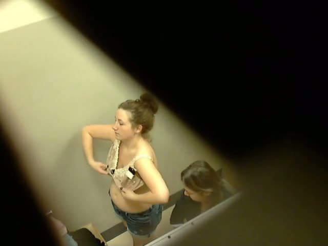 Cute blonde and a chubster on hidden cam in the changing room