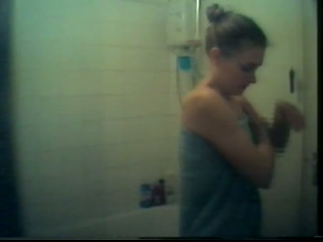 Slender cutie caught naked on a shower spy cam