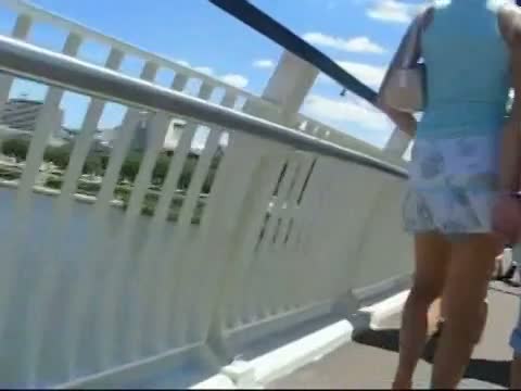 Blonde slut in red panties crossing a bridge with friends upskirt