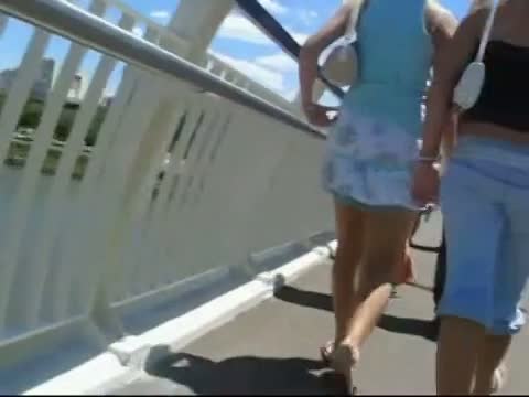 Blonde slut in red panties crossing a bridge with friends upskirt