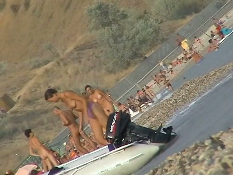 Naked amateur staying in water on beach voyeur hunter