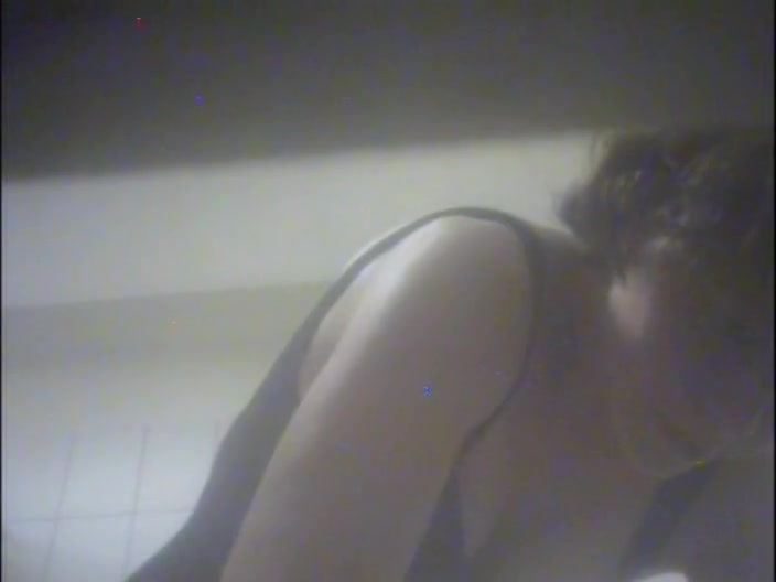 Amateur girl hiding nudity under lingerie on shower cam