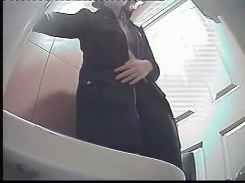 A milf pissing in the toilent to a voyeur spy cam