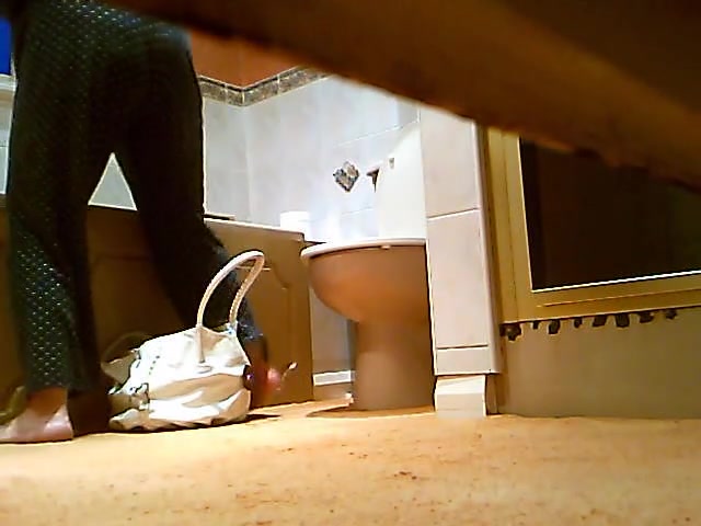 Blonde fem caught on spy cam pissing on toilet with phone