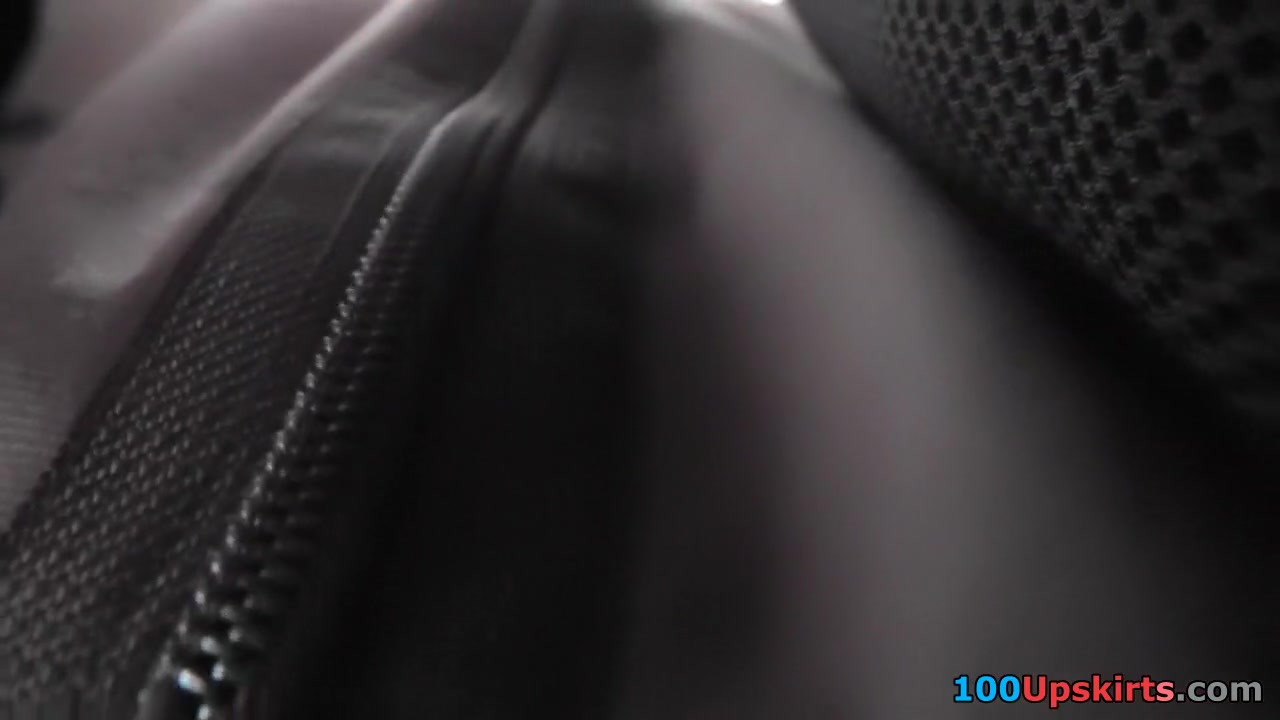 Black leather-style skirt on the upskirt tease tube