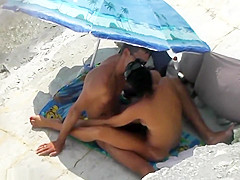 Naked mature on beach with 2 horny cocks