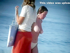 See those smooth nudists play at a public beach