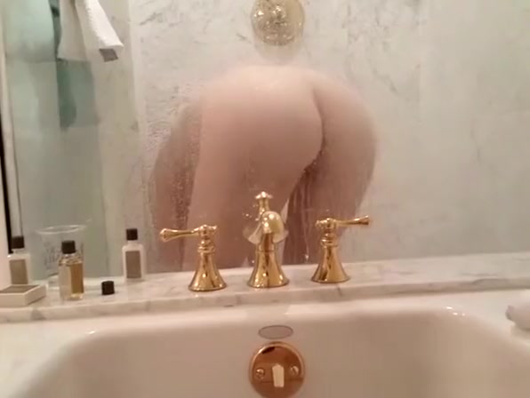 Wife takes shower in shower while husband is filming