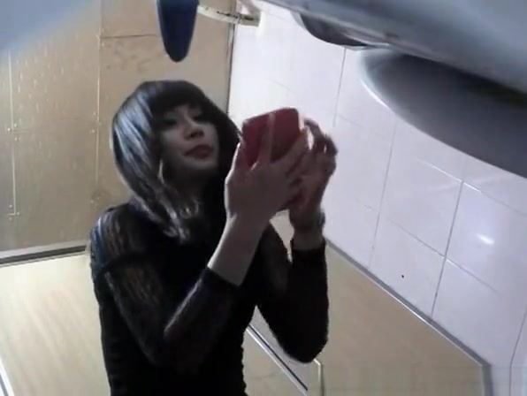 Asian woman takes a pee