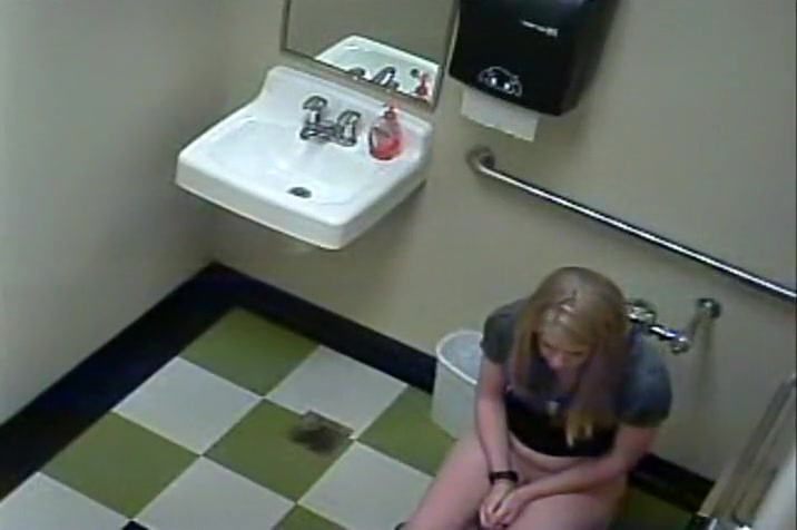 Blonde girl in pees in a public toilet